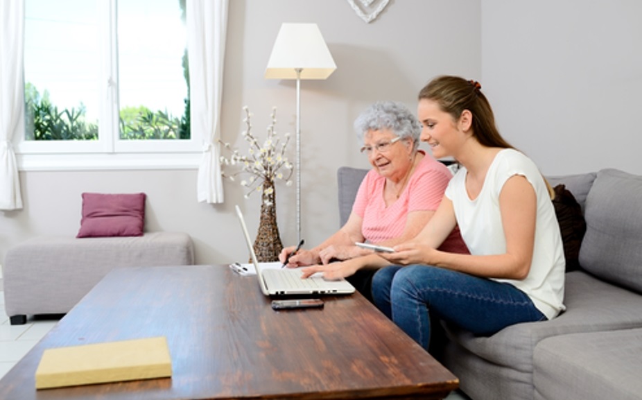 Older and younger woman reviewing documents